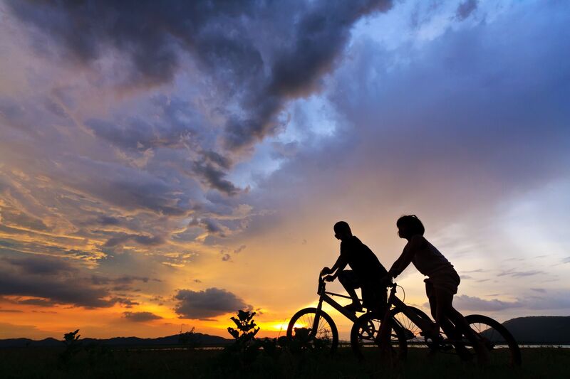 Man and Women on bikes to get their physical activity for the evening.